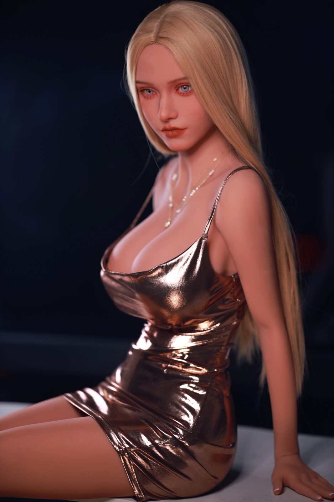 DutchDoll Mia 159 см секс-лялька сидить у золотій металік сукні з перловим намистом